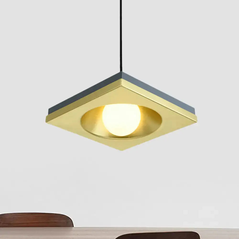 DecorBites™ pendant light with brushed brass square frame, matte black accents, and warm bulb base for bedrooms