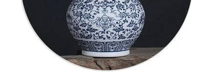 DecorBites™ blue and white ceramic vase with intricate floral and teapot motifs elegant home decor piece