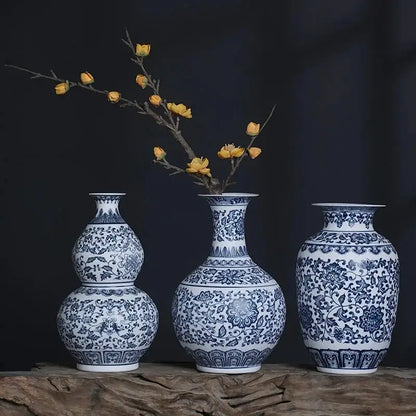 Three elegant blue and white ceramic vases with intricate floral patterns for stylish home decor by DecorBites