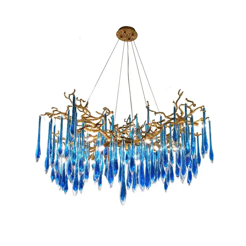 Elegant decorbites blue crystal chandelier with gold branching arms and teardrop crystals for dining room lighting