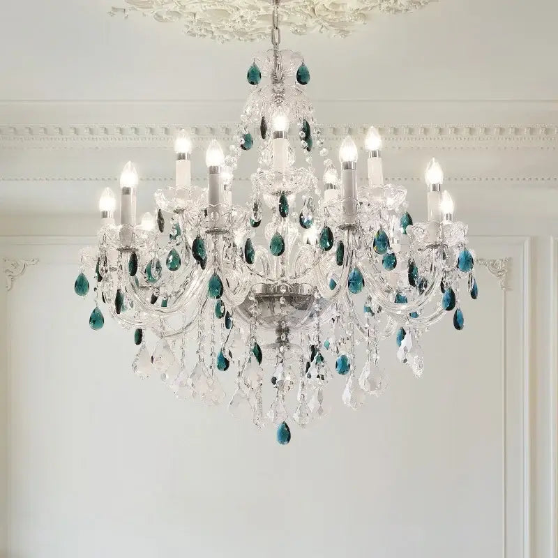 An elegant decorbites blue crystal chandelier with clear glass arms and teal crystal pendants for living rooms
