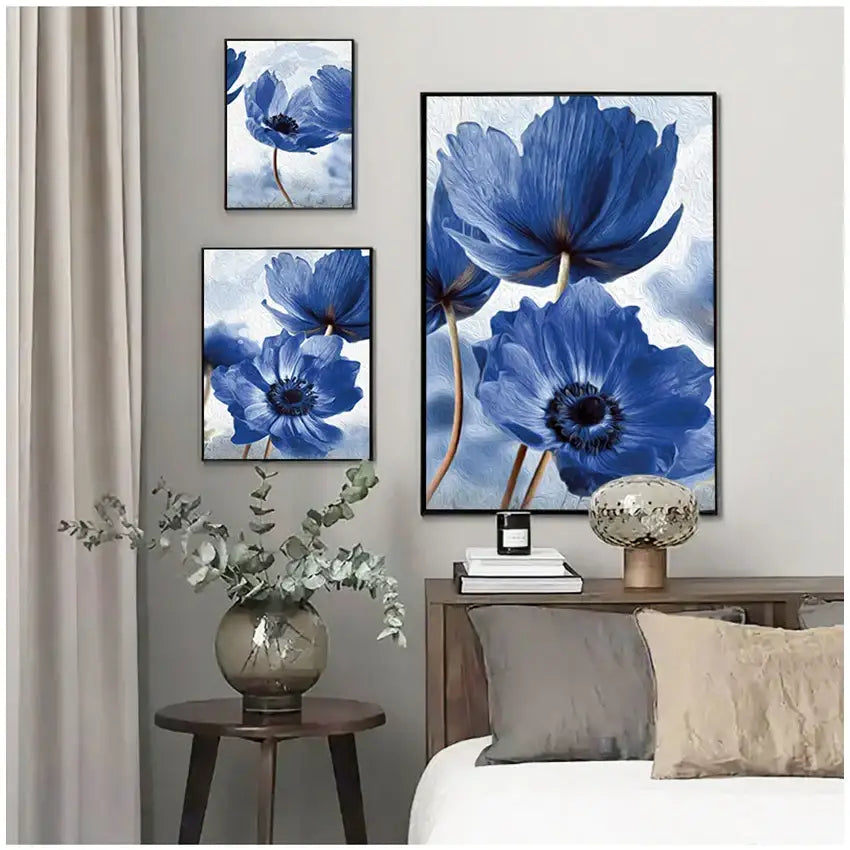 Set of three framed blue flowers wall art pieces with textured painterly surfaces in black frames for living room decor