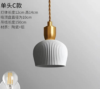 A modern pendant light with ribbed matte gray ceramic shade and polished brass fixture for decorbites blue glass pendant use