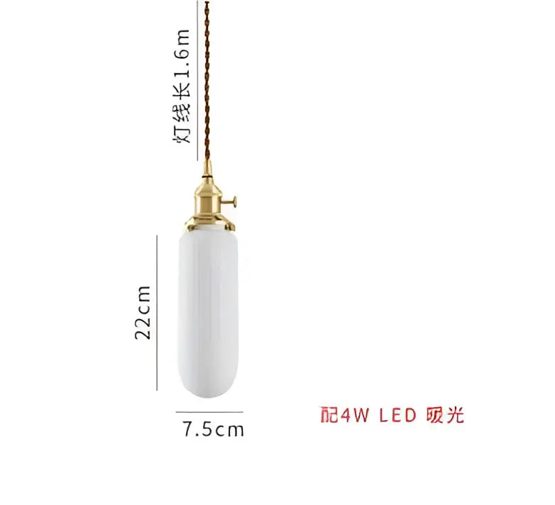 A sleek white ceramic pendant light with gold metal fixture and twisted cord complementing decorbites blue glass pendant light