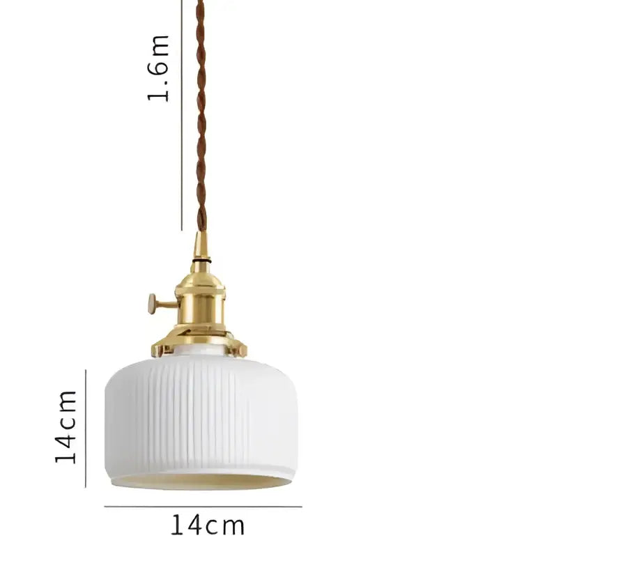 A white ribbed glass pendant light with brass fixture and twisted cord complements decorbites blue glass pendant lights