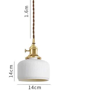 A white ribbed glass pendant light with brass fixture and twisted cord complements decorbites blue glass pendant lights