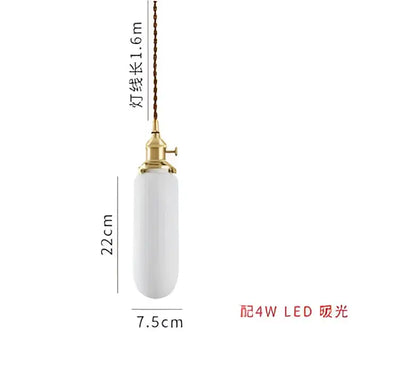 A sleek white ceramic pendant light with gold-toned fixture and twisted cord for modern interiors and decorbites blue glass pendant lights