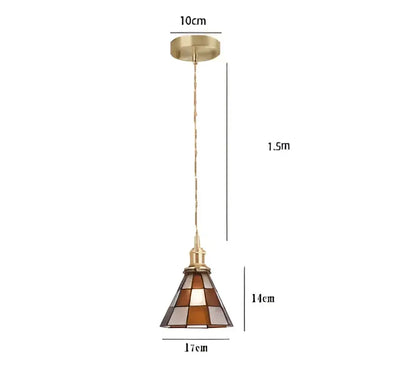 A brass finished pendant light with amber and clear stained glass shade for dining featuring decorbites blue glass