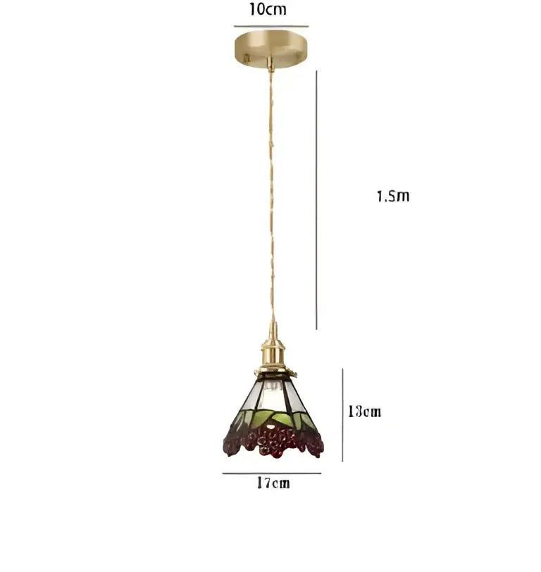 Vintage-style pendant lights with brass frame and stained glass shade featuring intricate grapevine patterns for dining room decorbites blue glass pendant