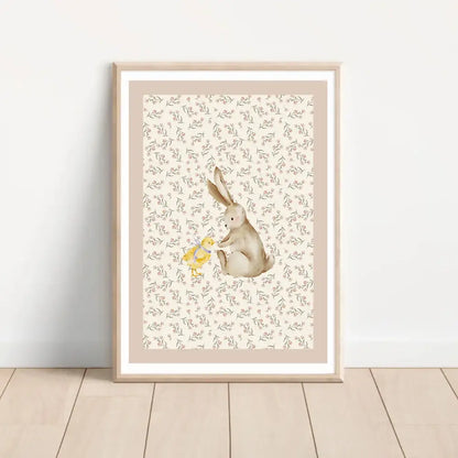 A framed bohemian style wall art set featuring a soft beige rabbit and yellow duck watercolor print with floral background