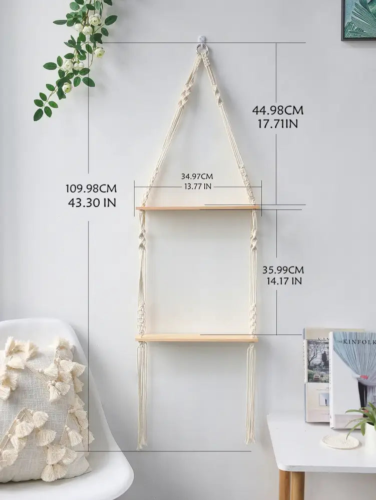 Beige DecorBites™ boho macrame wall shelf with two light wood shelves and hanging tassels for home decor