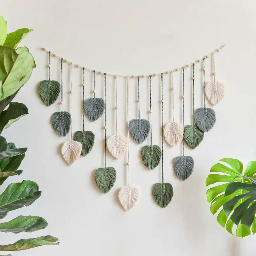 DecorBites™ boho style handmade tapestry with green and cream macrame leaves on wood dowel for living room decor