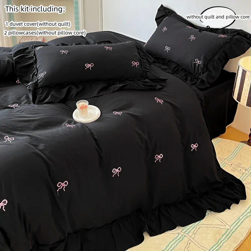 Decorbites™ bow embroidery bedding set featuring a black ruffled duvet cover with delicate pink bow embroidery