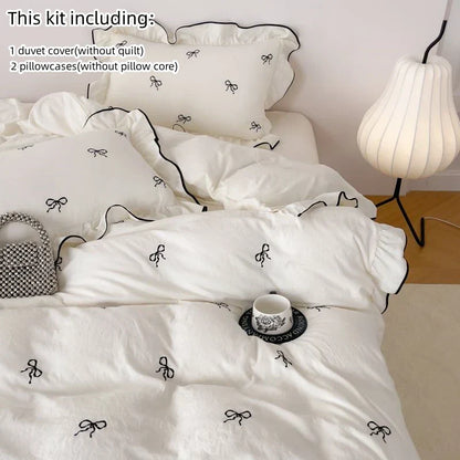 White duvet cover with black bow embroidery and ruffled edges from decorbites bow embroidery bedding set