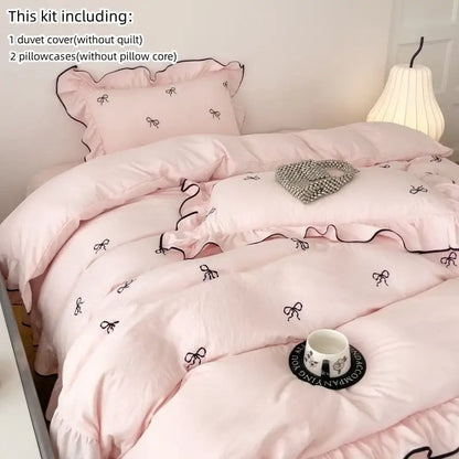 Pink duvet cover from decorbites™ bow embroidery bedding set with black ribbon bow embroidery and ruffled edges