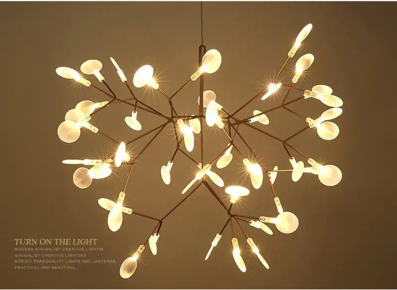 A modern minimalist branch design chandelier by decorbites with rose gold black metal frame and frosted glass bulbs