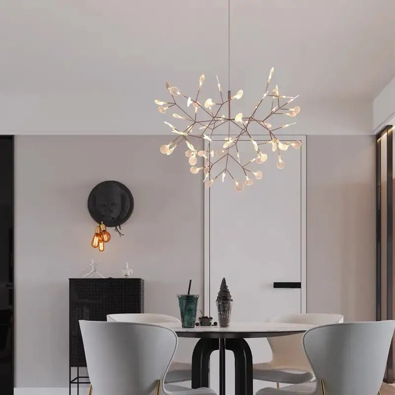 A modern decorbites branch design nordic chandelier with warm bulbs and rose gold black metallic frame