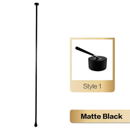 Matte black cocktail stirrer with sleek slender design and rounded ends accompanying brass black luxury single handle faucet