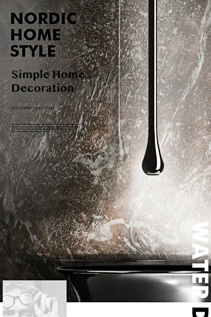 A sleek black teardrop pendant light complementing the decorbites™ brass black single handle luxury bathroom faucet
