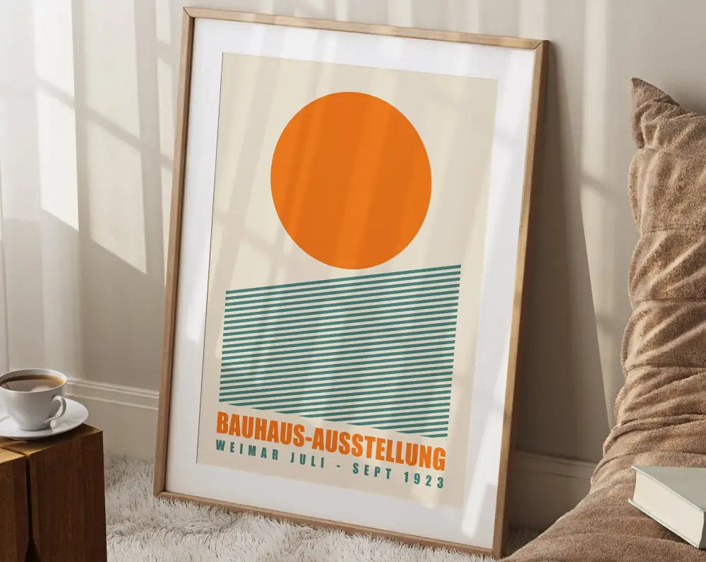 A framed bauhaus canvas print with bright geometric orange circle and teal stripes for modern home decor by decorbites