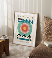 A framed DecorBites bright geometric wall art canvas print with bold blue teal and orange shapes on off-white background