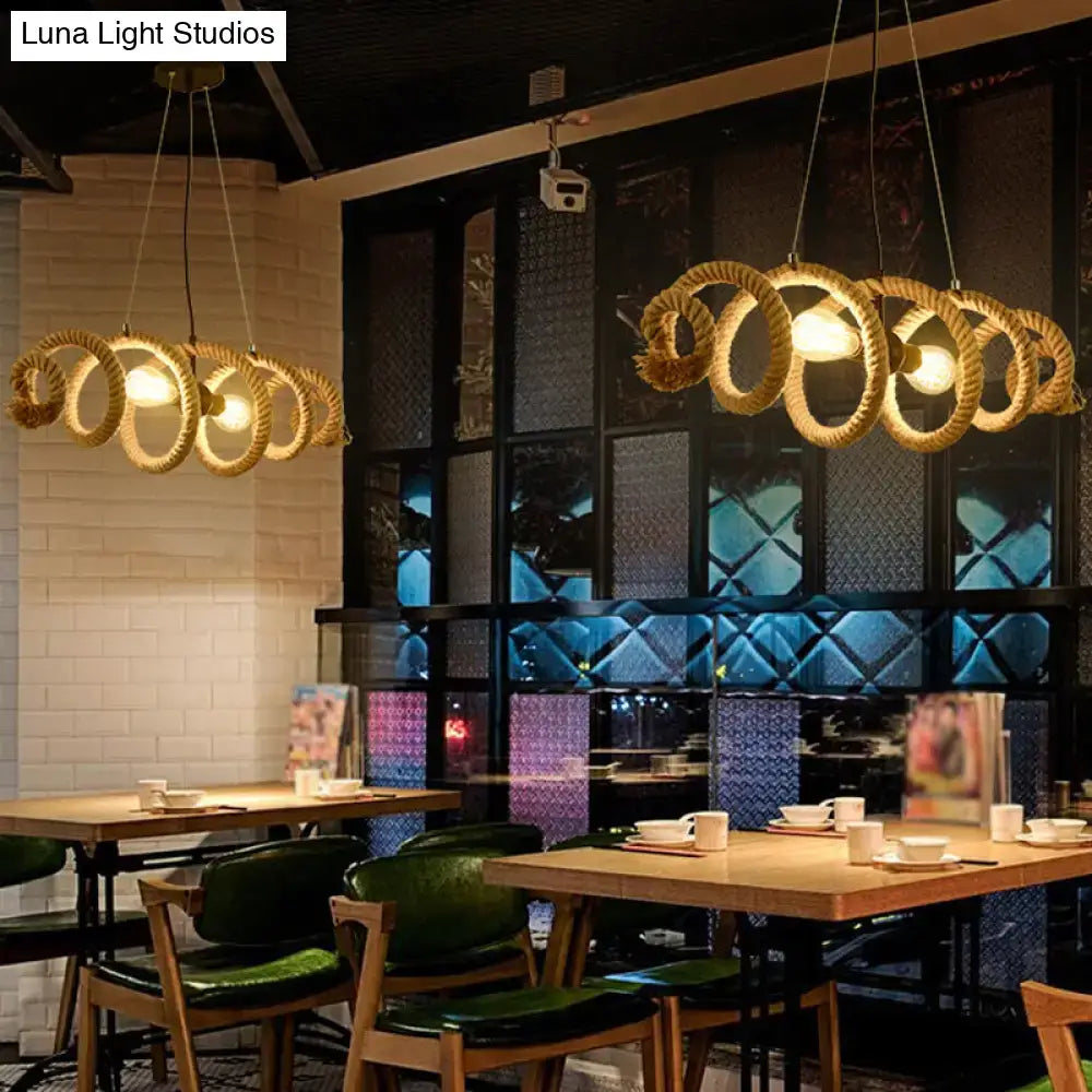 Decorbites™ brown rope wrapped helix island pendant with warm glowing bulbs ideal for restaurants and ceilings