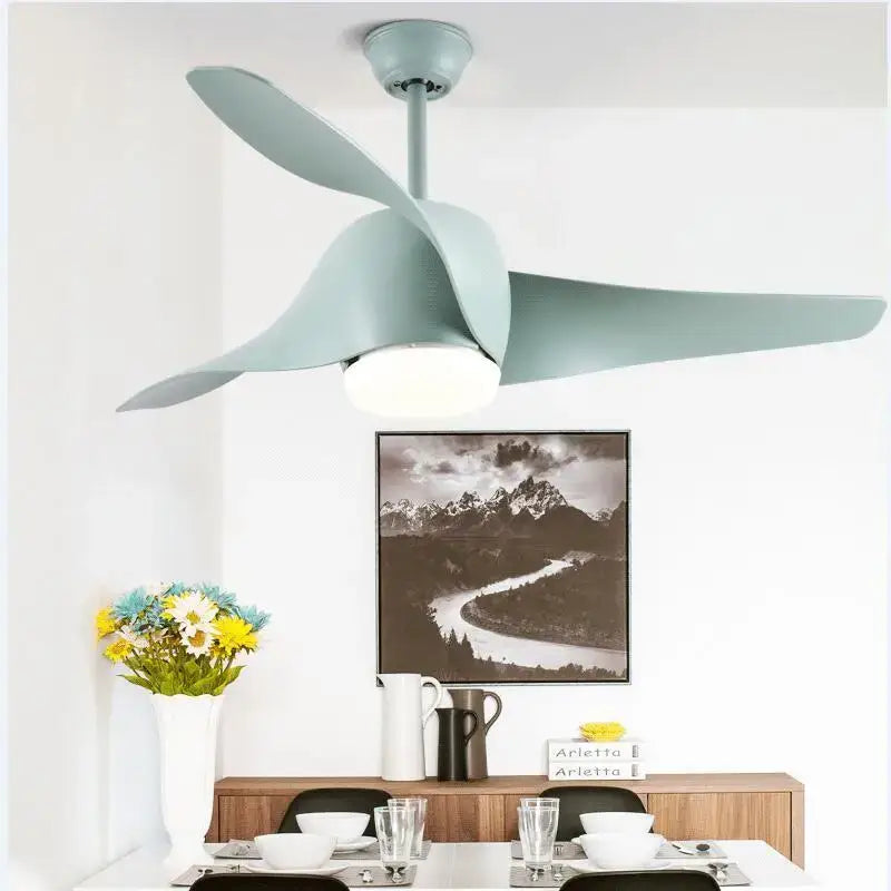 A modern mint green ceiling fan with sleek curved blades and integrated light in decorbites brown vintage remote control style