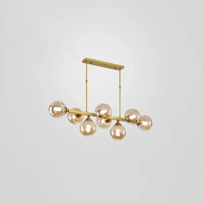 DecorBites™ bubbles glass pendant light features a gold-toned linear design with seven amber glass globe bulbs