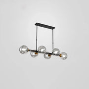DecorBites™ bubbles glass pendant light features modern black metal and brass accents with five clear glass globe bulbs