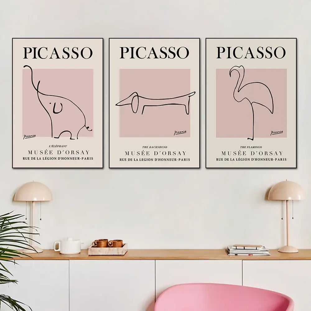 Three framed picasso-style minimalist black line animal prints on pale pink backgrounds in butterfly botanical canvas decorbites living room painting