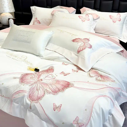 White satin bedding set with decorbites butterfly embroidery in pink and gold accents for luxury bedroom decor