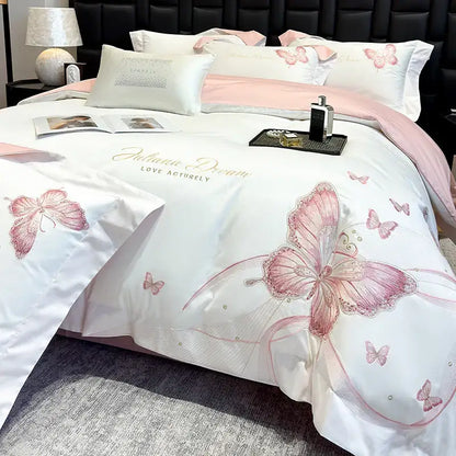 White satin bedding set with pink butterfly embroidery and gold script detailing from decorbites butterfly embroidery collection