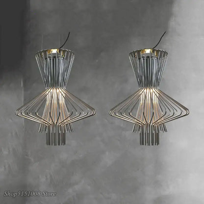 Modern chrome wireframe decorbites cage industrial pendant lights with geometric tiered design and warm illumination for kitchen