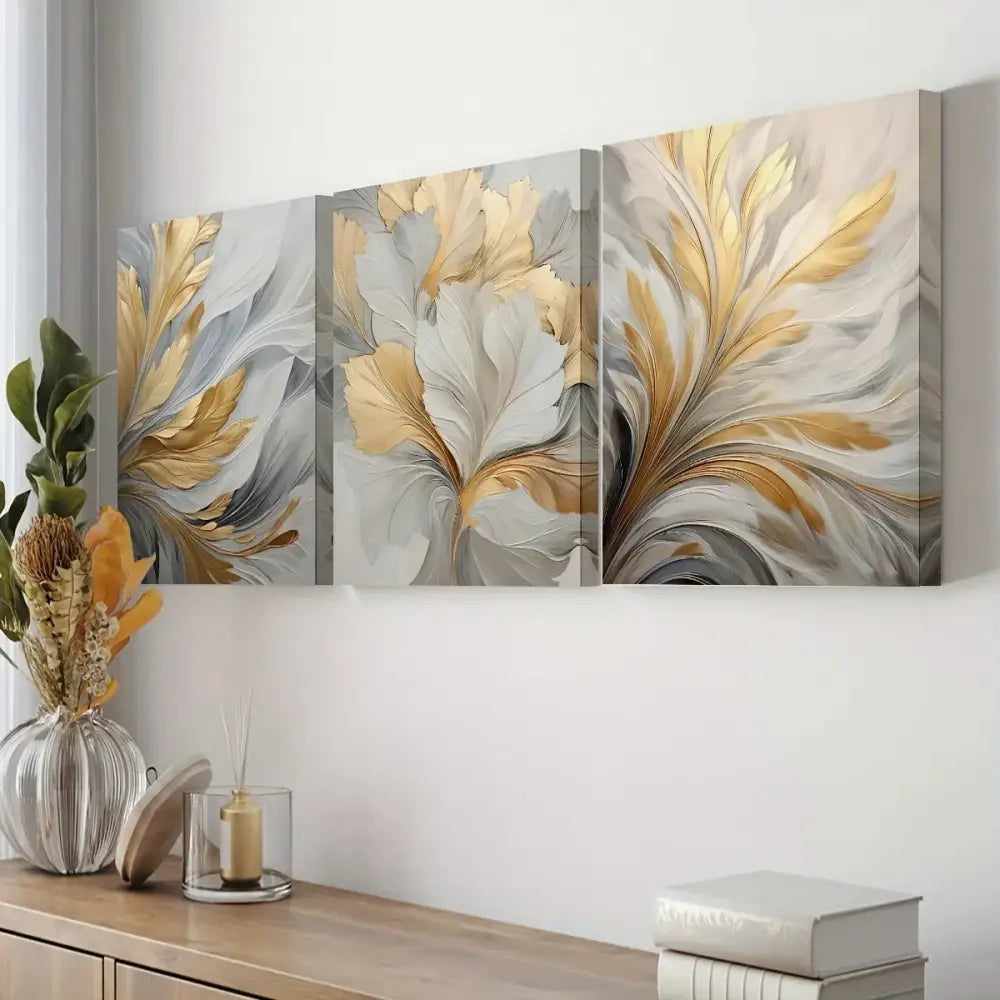 Decorbites canvas wall art set featuring three-panel abstract botanical prints with flowing golden and silver leaf motifs