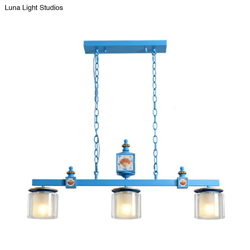Blue painted metal chandelier with three sky water blue glass shades and decorative shell motifs by DecorBites