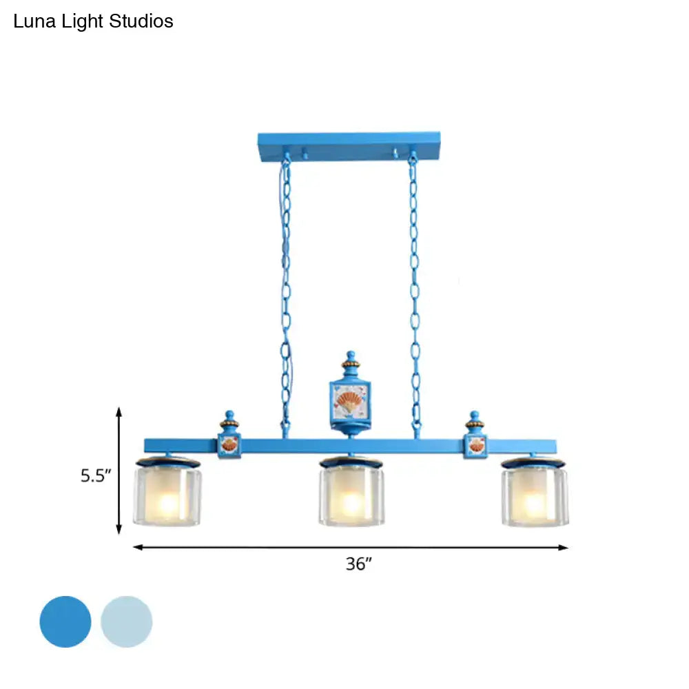 Blue painted metal chandelier with three sky water blue glass shades and decorative seashell motifs by decorbites
