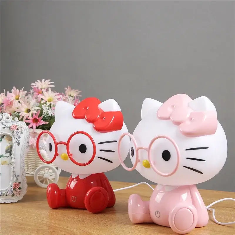 Two decorbites cartoon animal led night lights in red and pink featuring bows and round glasses for bedroom use