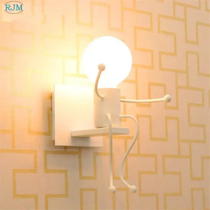 White ceramic decorbites cartoon children iron wall lamp with articulated limbs and glowing spherical head for bedroom decor