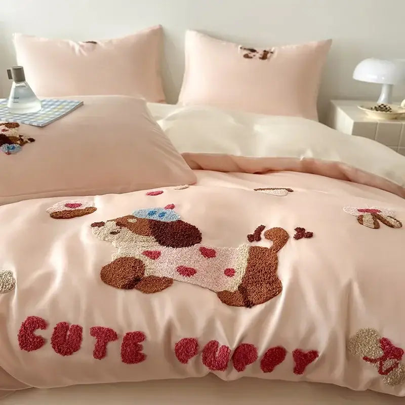 Pink satin duvet cover with plush brown and cream embroidered puppy wearing blue hat from decorbites cartoon embroidered cotton bedding set