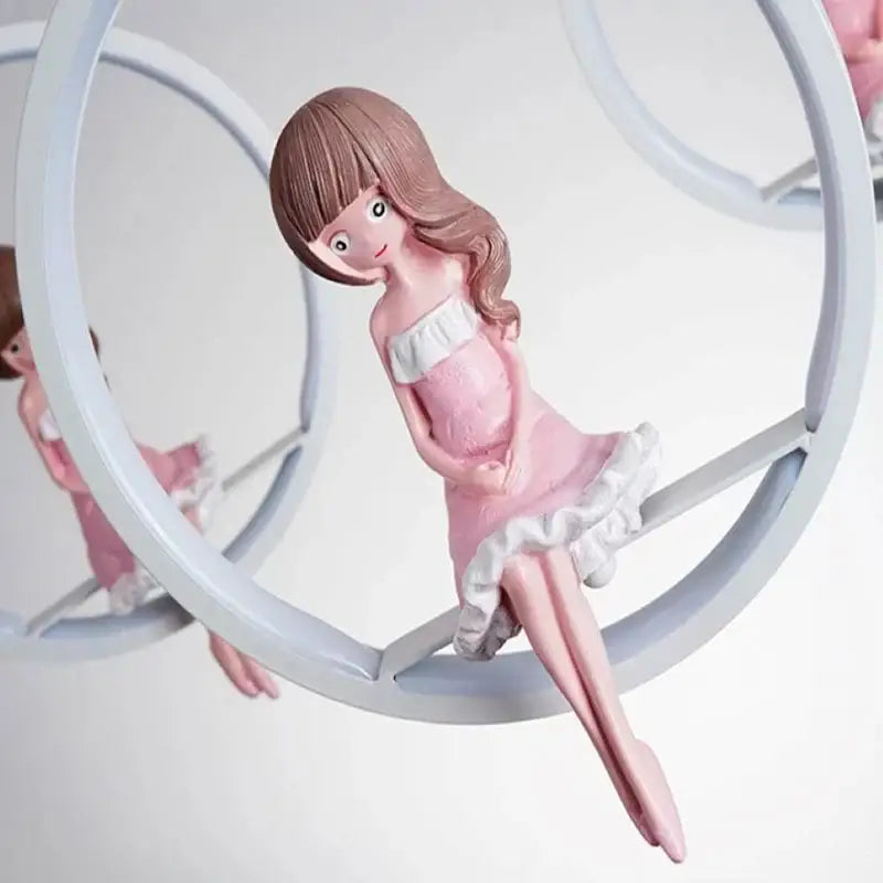 Pink resin decorbites cartoon princess figurine in off-shoulder dress within circular frame for kids chandelier light