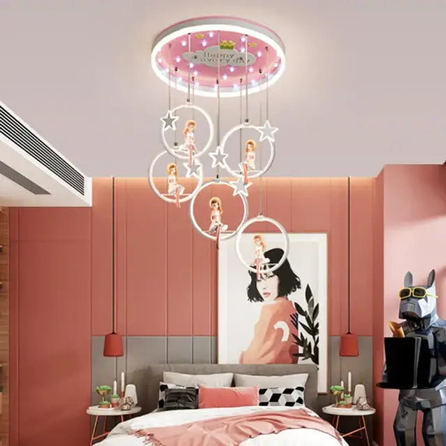 Pink circular led kids bedroom light with dangling white rings and star ornaments holding dolls decorbites cartoon princess chandelier