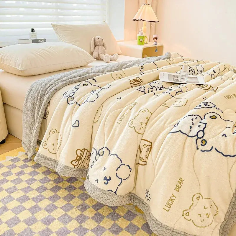 Cream-colored plush velvet quilted blanket with decorbites cartoon print bears and lucky bear text for bedroom bedding
