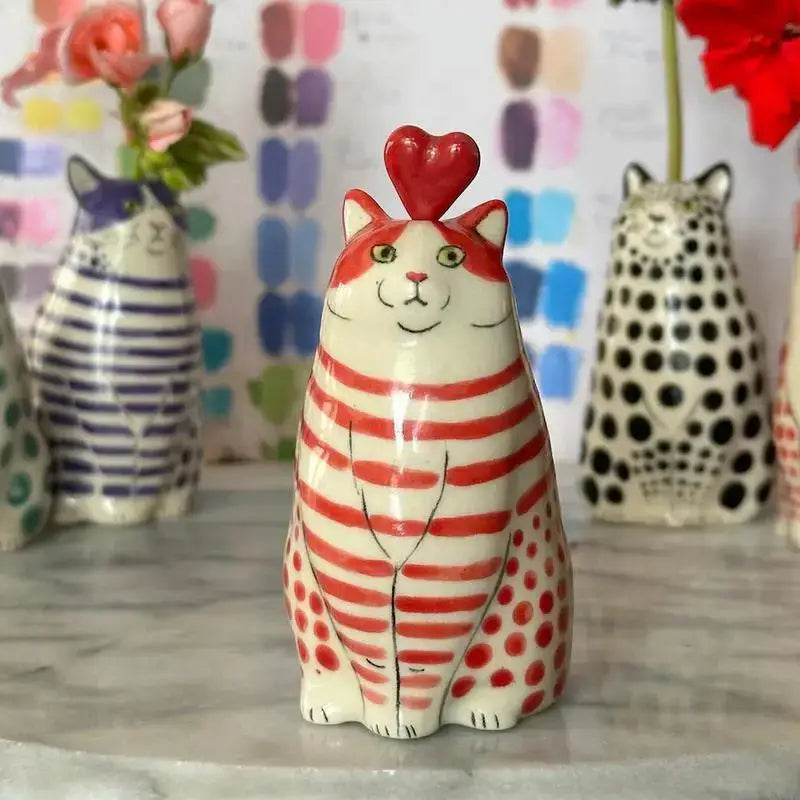 A charming red and white polka dot cat vase made of resin with a glossy red heart by decorbites™