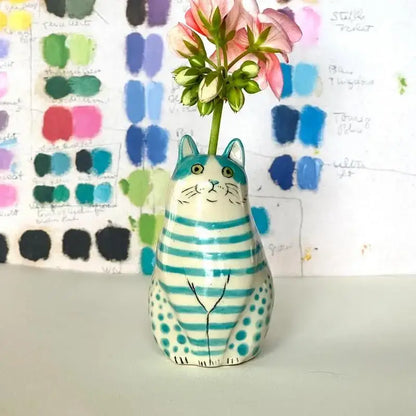 DecorBites™ cat vase in ceramic with turquoise and white polka dots holding a pink flower ideal as dot cat décor