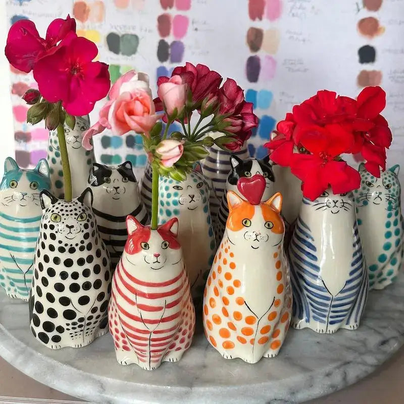 A collection of colorful ceramic cat vases with polka dot patterns from decorbites™ for flower display