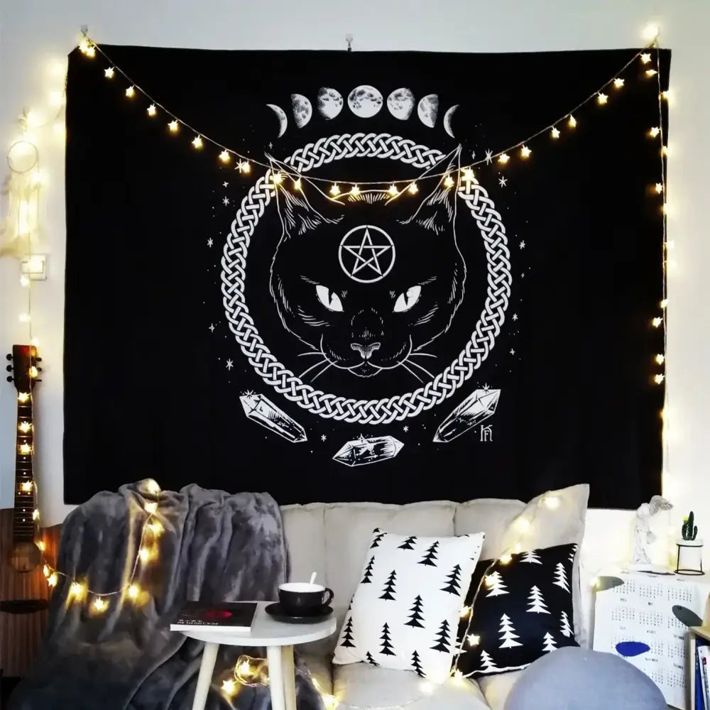 Black tapestry wall hanging by decorbites featuring cat witchcraft black face, pentagram, celtic knot, and moon phases