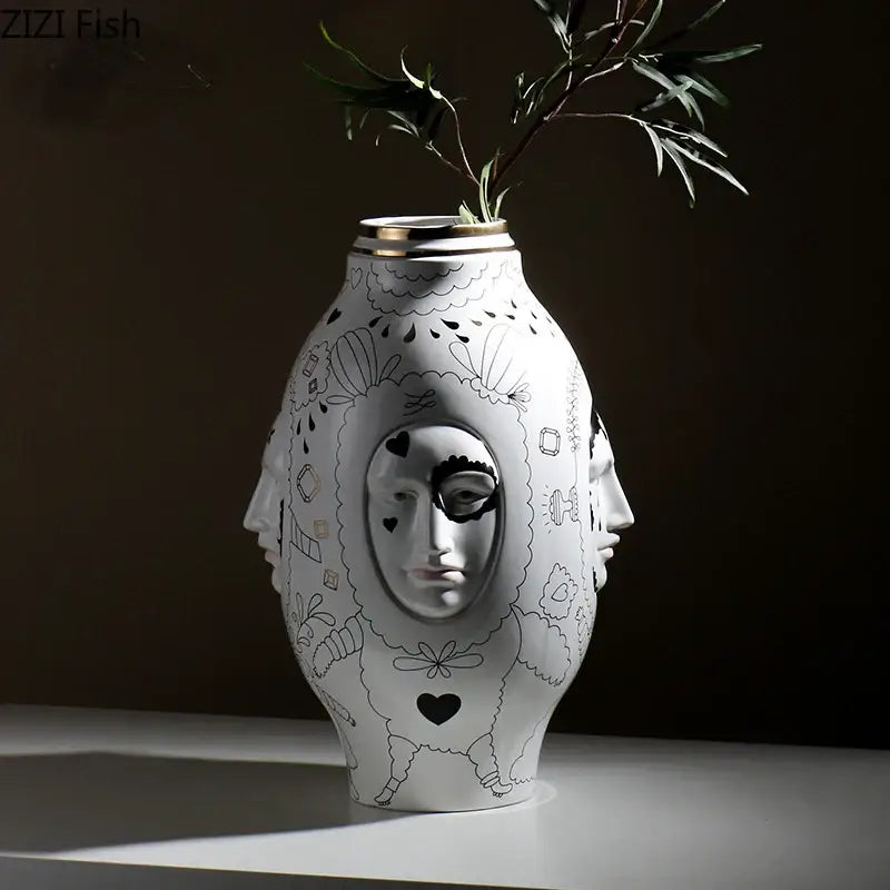 DecorBites™ ceramic vase desktop with white ceramic, black hand-drawn face design, and gold rim for floral arrangements