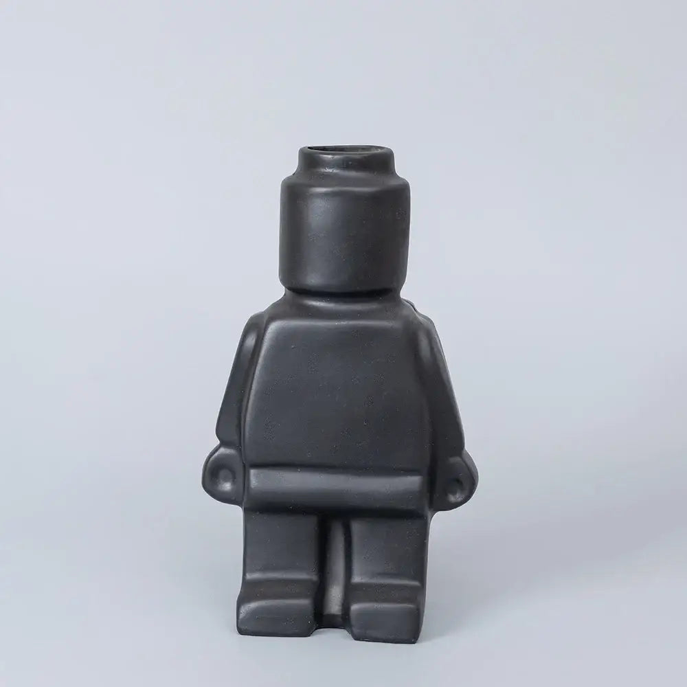 Black ceramic robot vase shaped like a lego minifigure from decorbites™ nordic style home decor collection