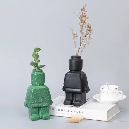 Decorbites™ ceramic robot vases in green glitter and matte black holding greenery and dried flowers nordic style home decor