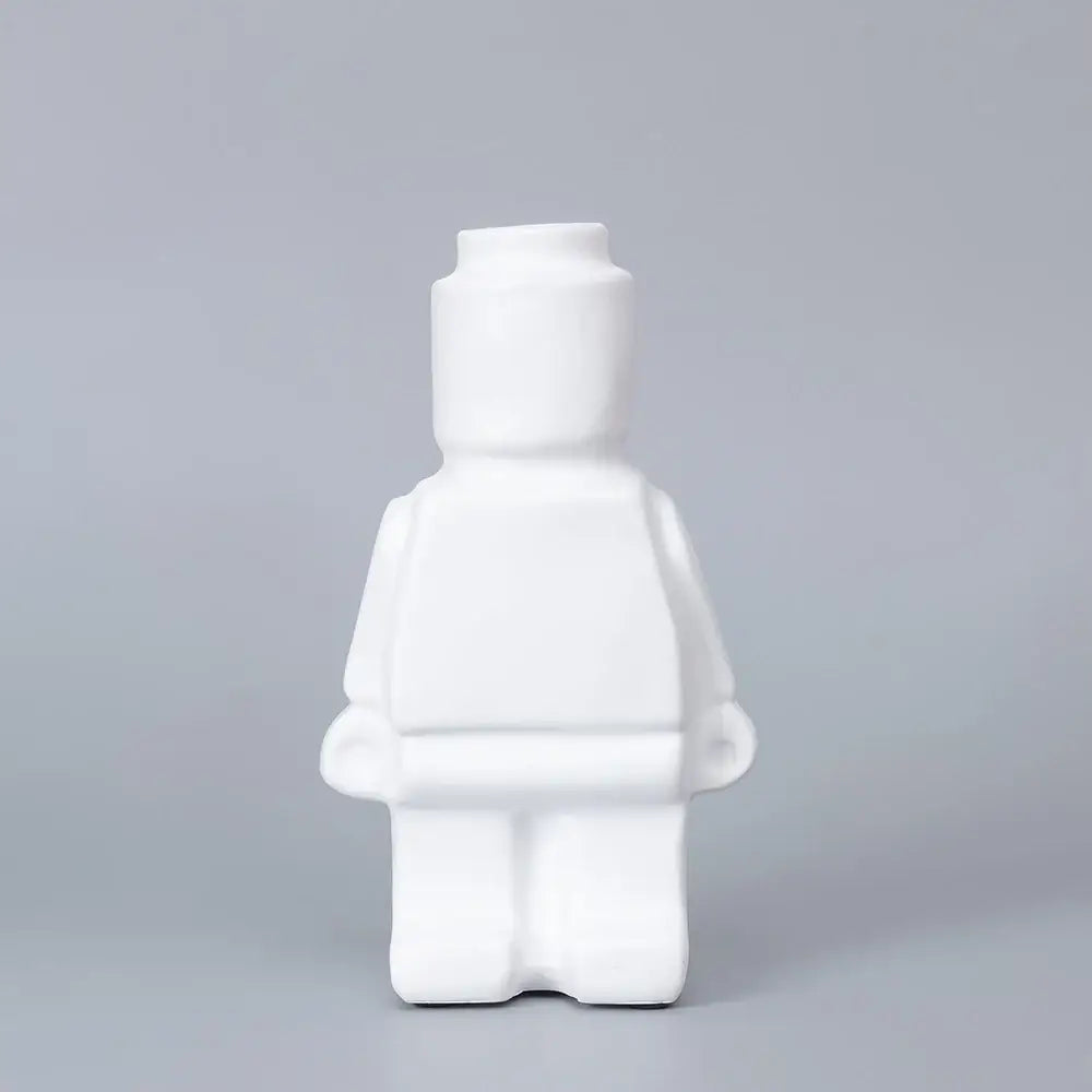 White ceramic robot vase shaped like a lego minifigure for nordic style home decor by DecorBites™